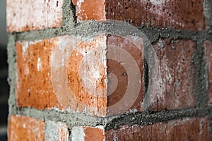 Close up of bricklaying industrial installing bricks on construc