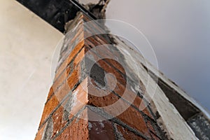 Close up of bricklaying industrial installing bricks on construc