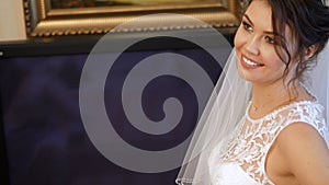 Close-up, bride fees. the bride is dressed for the wedding. portrait of a beautiful, smiling bride, in veil and lace