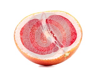 A slice of ripe grapefruit, isolated on a white background. Fresh, juicy, organic and cut in a half grapefruit full of vitamins.