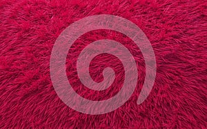 Close-up of a bright pink soft fur surface