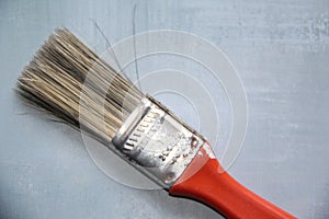 Close-up on the bristles of a red brush isolated photo