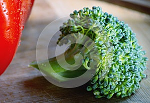 Close-up Broccoli with tomato on wood