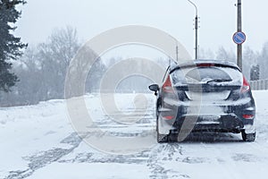 Close up broken down car at the side of the road in winter