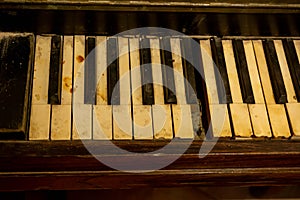 Close Up on Broken Old Piano Keys on Blurred Background