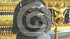 Close up of a bronze chinese lion statue at wat phra kaew temple in bangkok