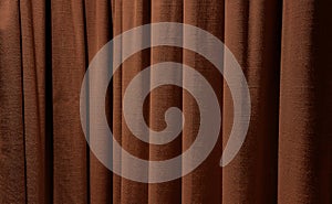 close up brown curtains use as background. sackcloth texture drape for vintage interior design.