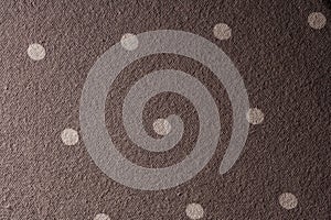 Close-Up of Brown Fabric with Light Polka Dot Pattern