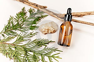 close up brown glass bottle with serum or oil for face or body on the beige background. cosmetology,