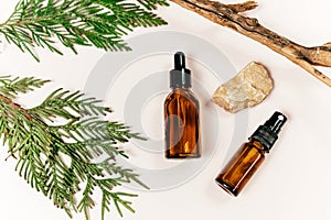 close up brown glass bottle with serum or oil for face or body on the beige background. cosmetology, self care,