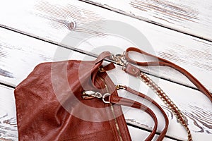 Close up brown leather satchel.