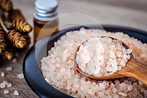 Close up brown organic Himalayan rock salt spa and cinnamon essential oil aroma set on table , healthy spa relaxation concept