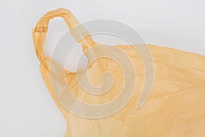 Close up of brown plastic bag, The plastic surface is wrinkly and tattered making abstract pattern