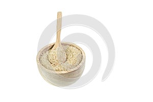 Close up of brown sugar in wooden bowl isolated on white