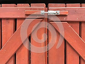 Brown wooden fence with padlock