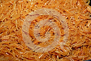 A close up of browned in Butter sweet Egyptian vermicelli cooked with water and sugar in a cooking pot