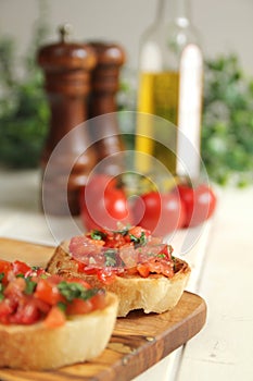 Close up of brushetta with olive oil, garlic and fresh basil