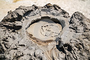 Close-up of bubbling mud in crater of mud volcano