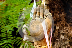 Close up Buddha Hand stone sculpture in Thailand Temple