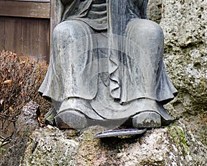 Close-up of Buddha statue at Japanese garden