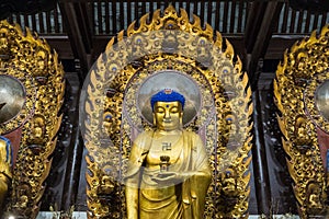 Close-up of Buddhist God statue in the ancient longhua temple. China, Shanghai