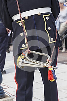 Close up of bugler from behind in uniform