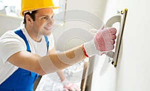 Close up of builder working with grinding tool