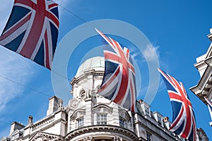 Close up of building on Regent Street London with row of British flags to celebrate the wedding of Prince Harry to Meghan Markle