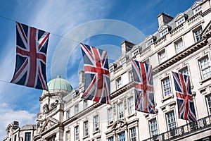 Close up of building on Regent Street London with row of British flags to celebrate the wedding of Prince Harry to Meghan Markle