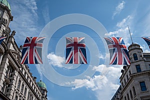 Close up of building on Regent Street London with row of British flags to celebrate the wedding of Prince Harry to Meghan Markle