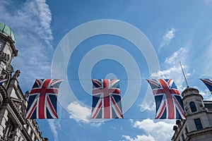 Close up of building on Regent Street London with row of British flags to celebrate the wedding of Prince Harry to Meghan Markle