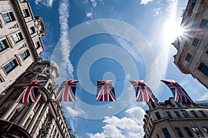 Close up of building on Regent Street London with row of British flags to celebrate the wedding of Prince Harry to Meghan Markle