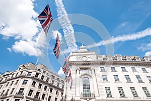 Close up of building on Regent Street London with row of British flags to celebrate the wedding of Prince Harry to Meghan Markle