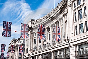 Close up of building on Regent Street London with row of British flags to celebrate the wedding of Prince Harry to Meghan Markle