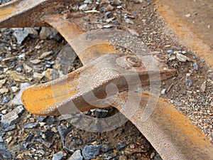 Close-up of a bulldozer blade, detachable rusty steel spike.
