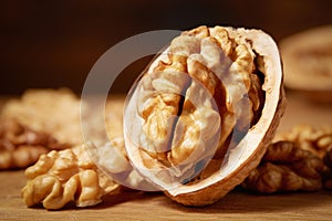 Close-up of a bunch of walnuts on a wooden background. Macro photography. Studio shot