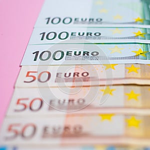 close up bundle of money Euros banknotes on the color background, business, finance, saving, banking concept