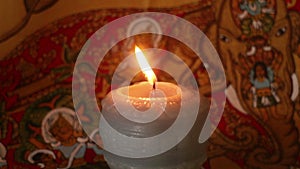 Close up of Burning Candle against Exotic Background (Static)