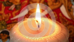 Close up of Burning Candle against Exotic Background (Static)