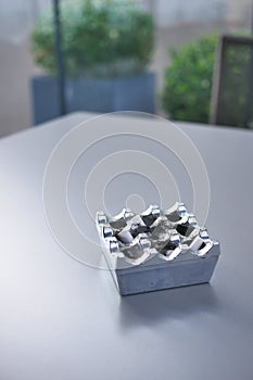 Close up burning cigarette in ashtray on table