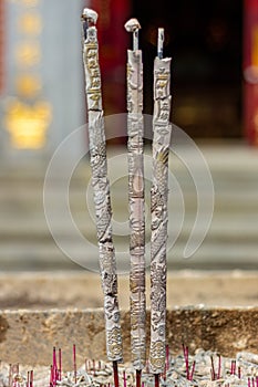 Close-up of burning incense sticks at an Asian temple