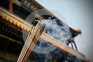 Close up of burning incense sticks in a pagoda