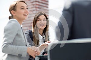 Close up.business colleagues sitting at the Desk