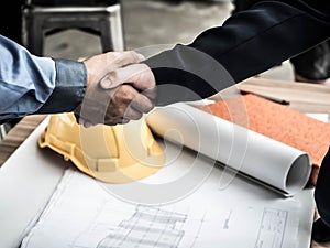 Close-up of business engineer planing at construction site project, documents, worker tool