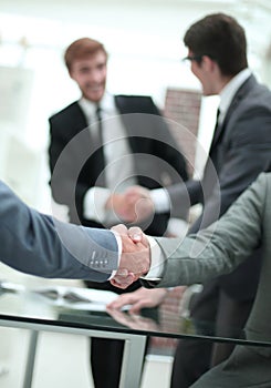 Close up. business handshake in a modern office .