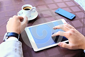 Close-up of business male hands touching digital tablet