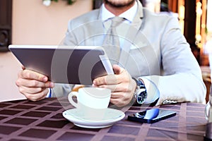 Close-up of business male hands touching digital tablet