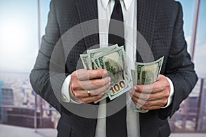 close up business man in classik black siut hold and check dollar
