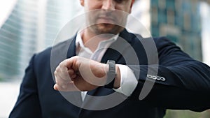 Close up of business man hand checking time for appointment or meeting. Urbane.