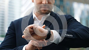 Close up of business man hand checking time for appointment or meeting. Urbane.